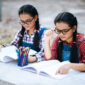 two students studying together online with laptop park 85x85